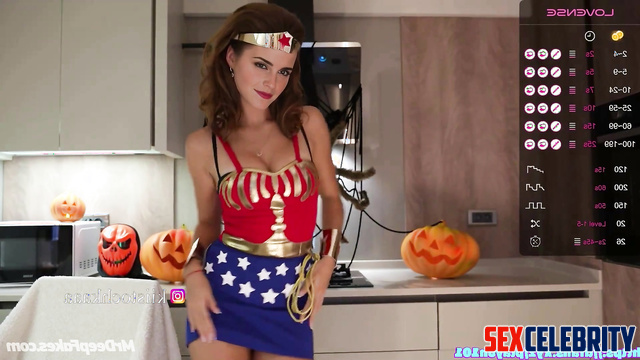 Brunette in superhero suit drinking wine on webcamera, fake Emma Watson