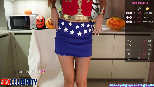 Brunette in superhero suit drinking wine on webcamera, fake Emma Watson