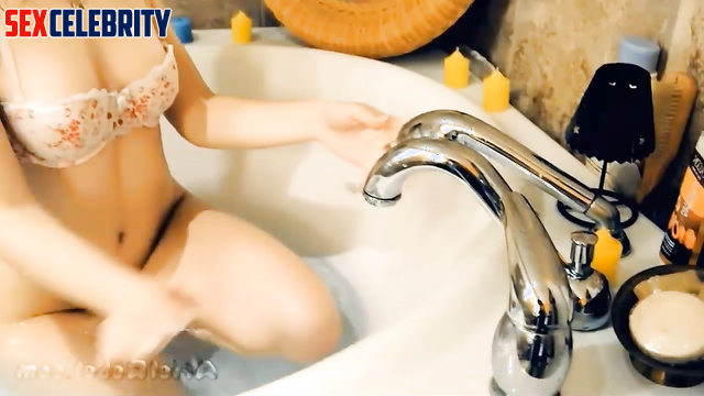 Fakeapp Coline D'Inca takes pleasure in caressing her pussy in her bathtub with her hands
